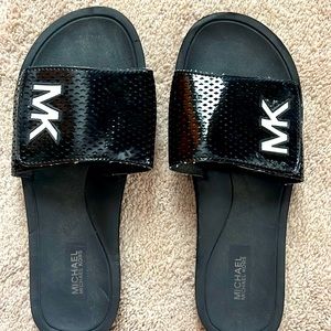 Women's Michael Kors black pool slides size 9.